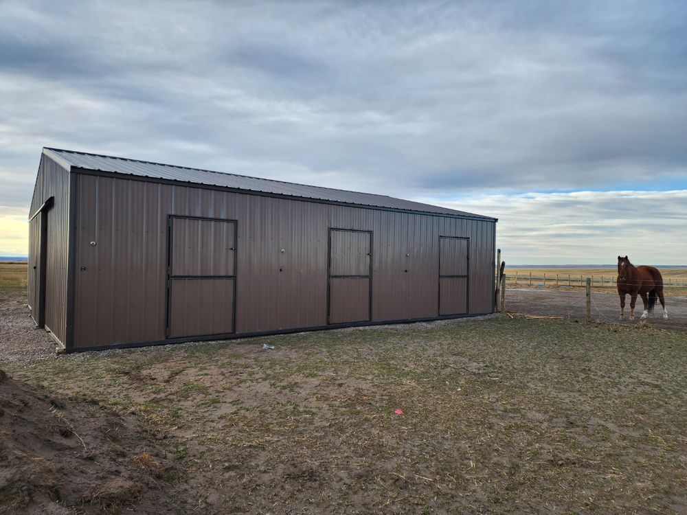 Side elevation of a metal horse barn showing three custom-built metal dutch doors opening to the pasture