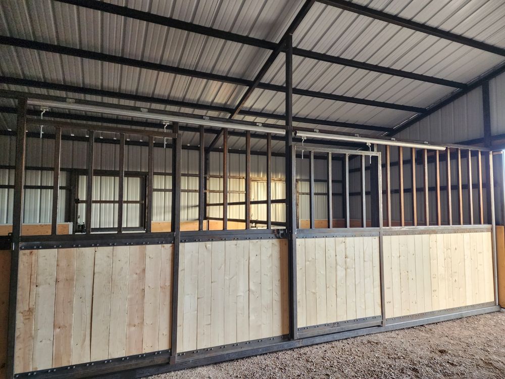 Steel-framed sliding stall fronts with wood plank lower panels and open steel grill uppers